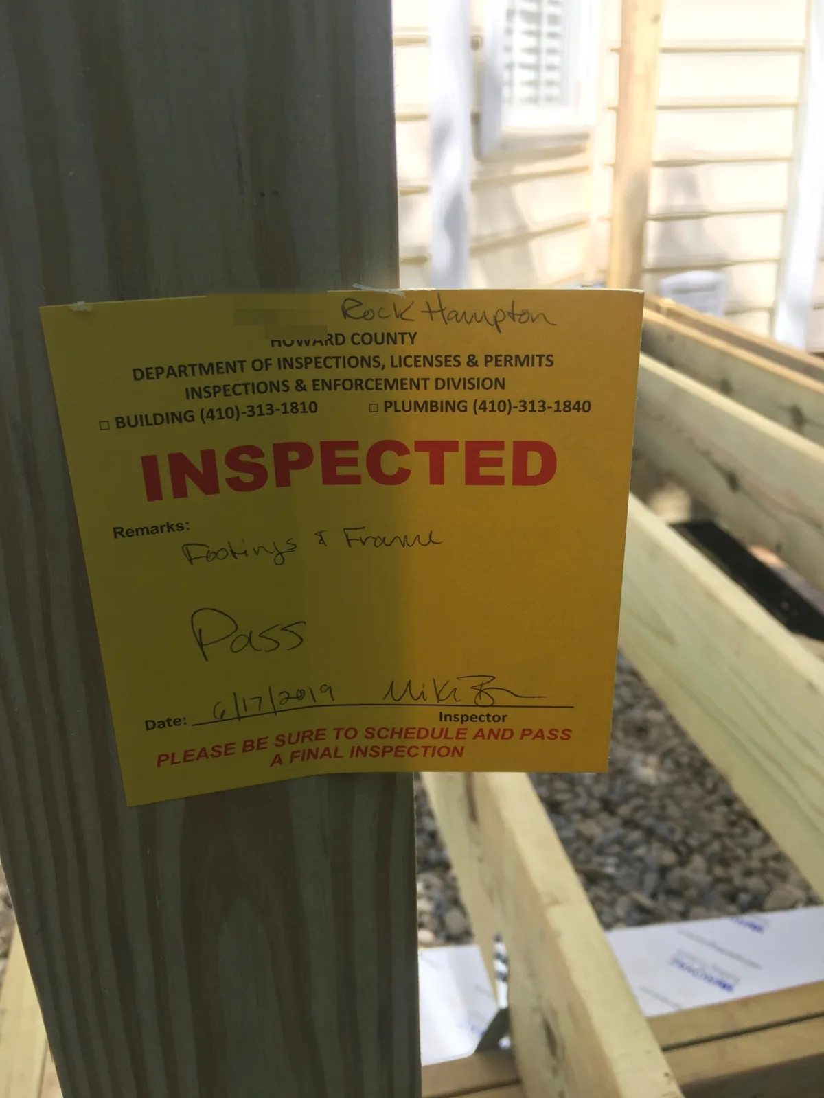 Howard County INSPECTED sticker on the framing of a PRG Home Improvement deck project