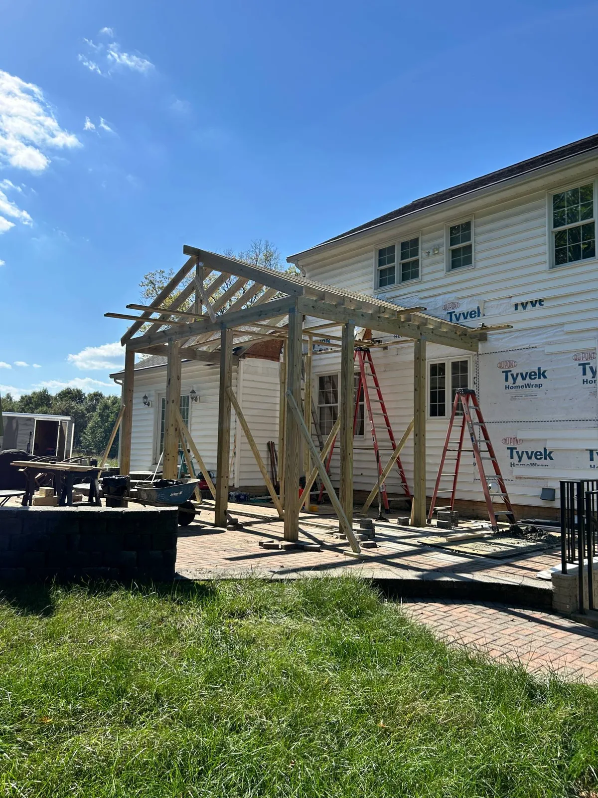 Porch roof framing in progress on a Maryland home by PRG Home Improvement