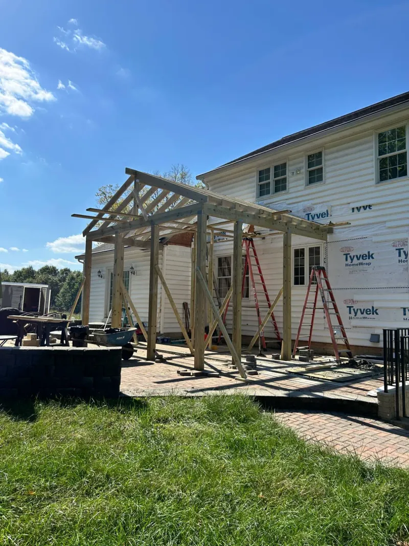 Porch roof framing in progress on a Maryland home by PRG Home Improvement