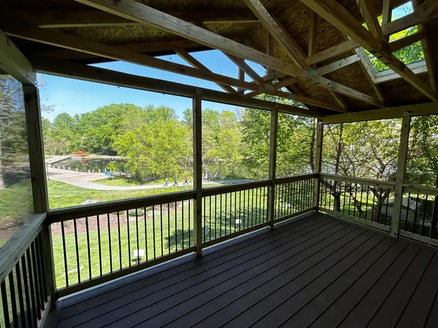 Interior of elevated screened porch overlooking Lake Elkhorn in Owen Brown Village Columbia MD
