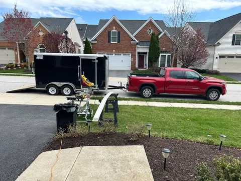 PRG Home Improvement truck and job trailer set up in a Maryland new-construction neighborhood