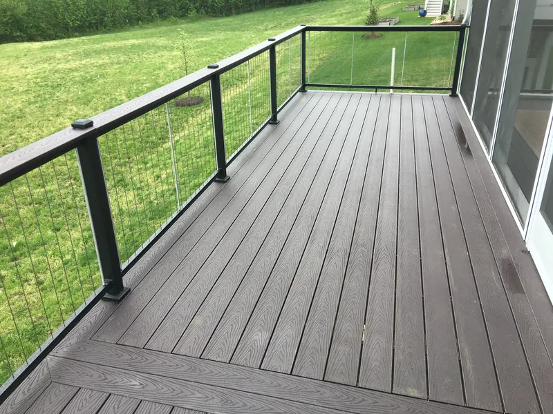 Composite deck with cable railing and chevron board detail at Two Rivers home in Odenton MD