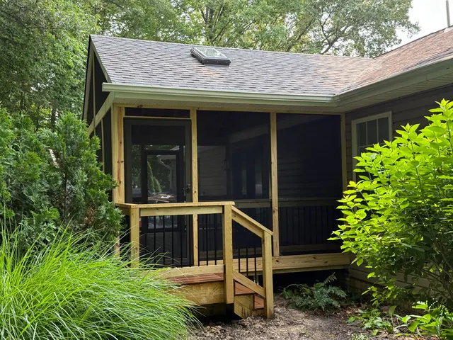 Screened porch addition with composite decking at a Davidsonville MD home